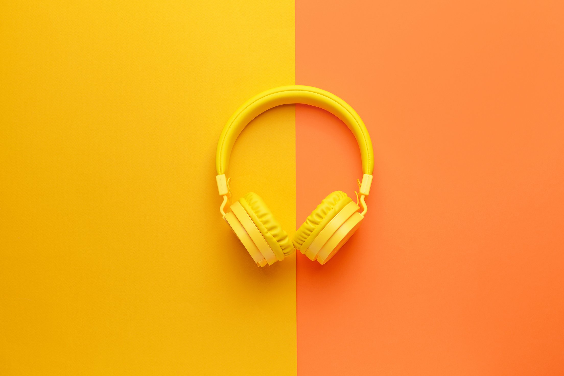 Modern Headphones on Color Background