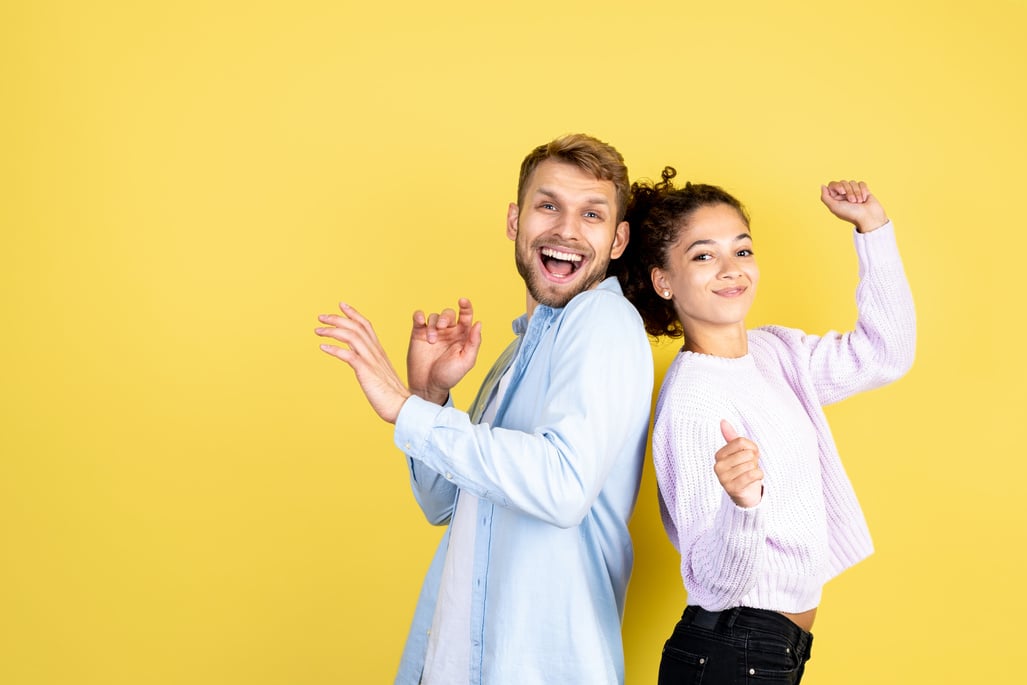 Two mixed race people on yellow background